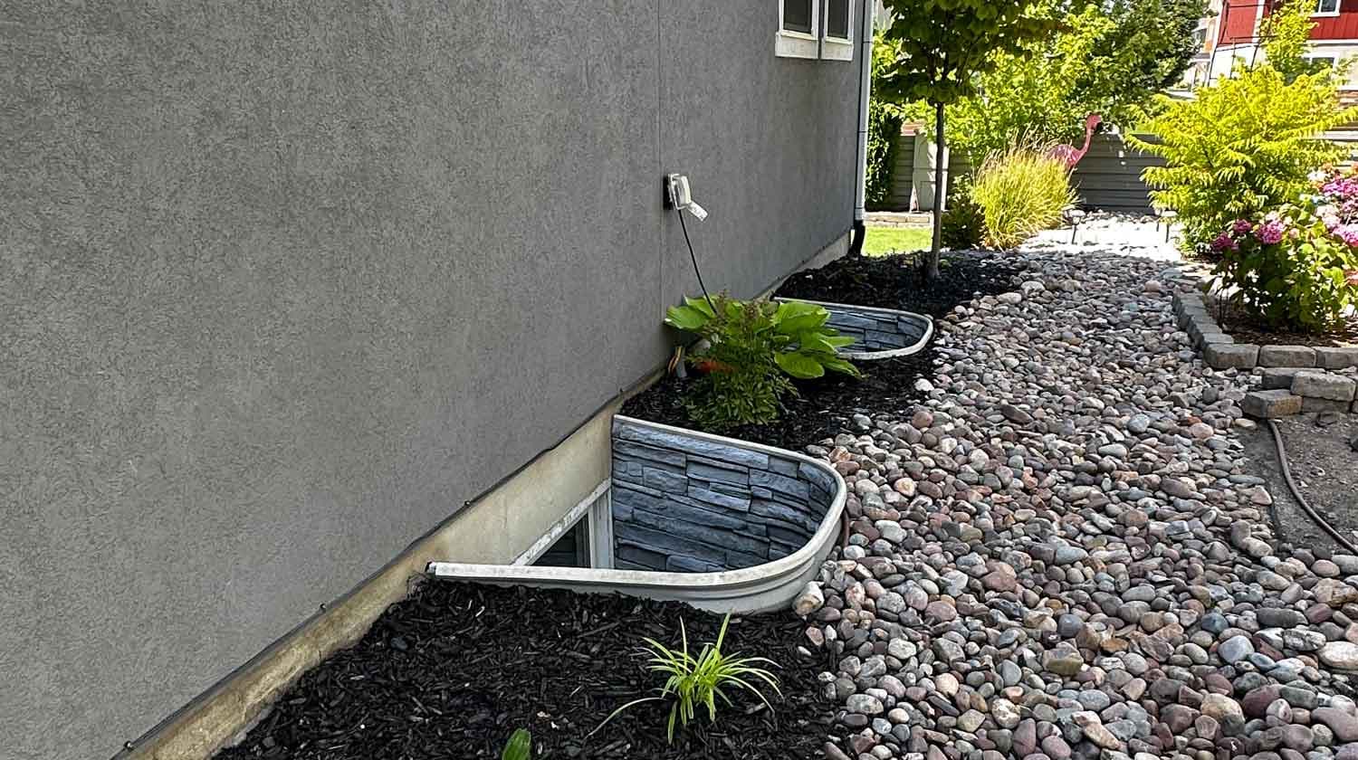 WonderWell window well cover installed on a home